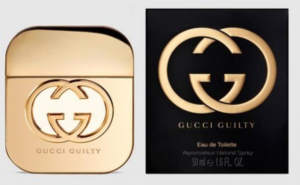 Gucci Guilty pentru femei, piersică și piper roz sub flaconul auriu
